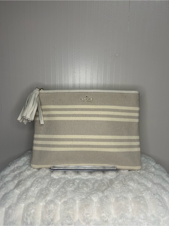 kate spade Handbags - kate spade Neutral Striped Canvas Tassel Pouch in Beige and Cream
